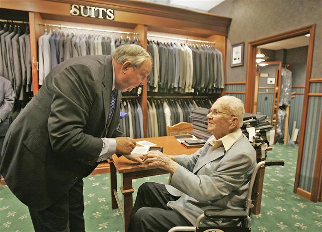 Elmer Miller (left) founder of Richard Bennett Tailors, meets with regular customer Henry Nagy in 2008. The business is now run by Richard’s son, David, and David’s son, Matt, is also involved. After 55 years at Mayfair, the business is moving to Brookfield Square.