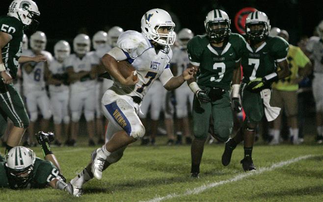 New Berlin West’s Travis McKeon breaks free and runs for a a touchdown to tie Wauwatosa West on Friday in the third quarter.