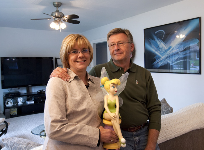 Karen Wenzel and her husband Gene Wenzel are seen holding a statue of Tinkerbell in their home. Tinkerbell is symbolic of the couple's deceased daughter.