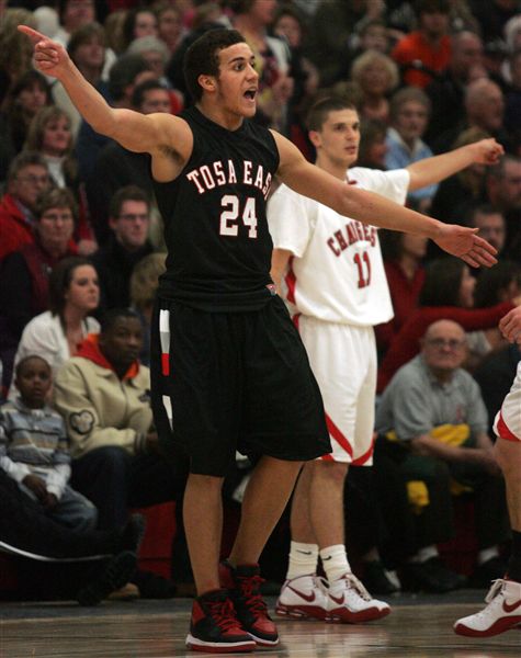 Wauwatosa East's Barett Powell and Hamilton's Kameron Cerroni both react to a foul call during the quarter.