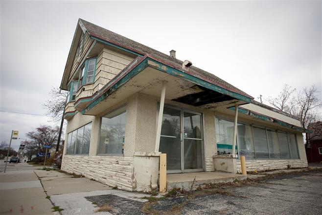 A former dry cleaning business at 2578 N. Wauwatosa Avenue shows signs of years of neglect.