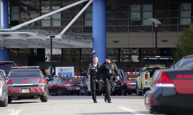 Law enforcement officers work outside Children’s Hospital of Wisconsin during a shooting incident last week.