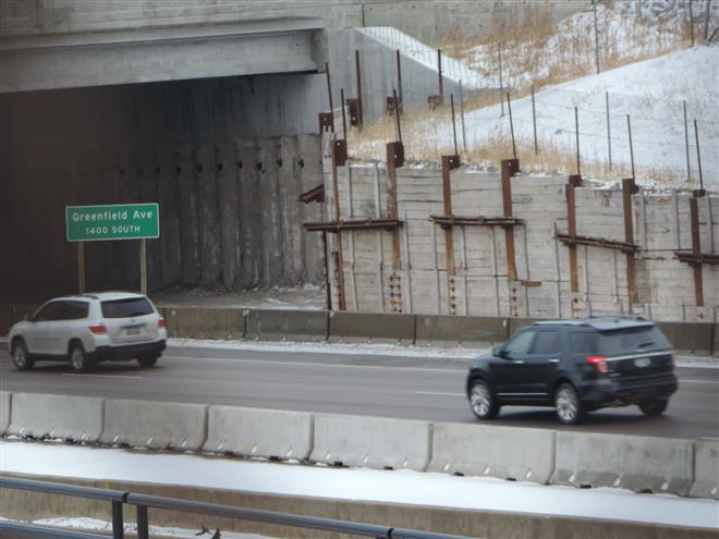 An unfinished wall next to the bridge on Interstate 894 at Greenfield Avenue generated a question from one of our readers. The wall will not be completed any time soon.