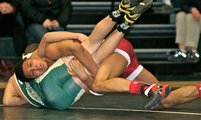 Jordan Boettcher defeated his 145-pound opponent, 10-6, to help Wauwatosa edge Greenfield, 35-34, last week.
