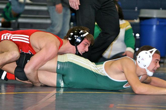 Ben Reagan won the 138-pound championship on Saturday at Pius XI in the Woodland Conference Tournament.
