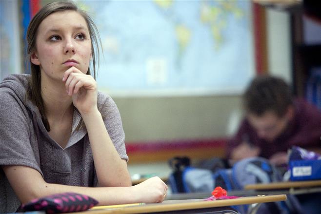 Wauwatosa West High School senior Marena Leisten, 17, playing the part of a witness, looks on during practice.