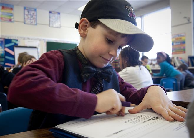 Washington Elementary School second-grader Cole Esser completes a classroom exercise earlier this year. Students in Wauwatosa public schools attend school for 180 days each year, as required by the state.