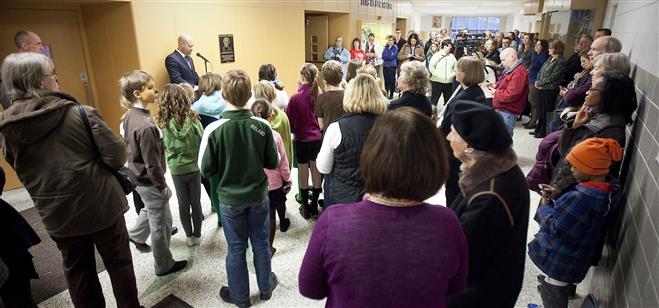 A small group of people gather for the naming of the Longfellow Middle School Theater after Lois Weber on March 27.