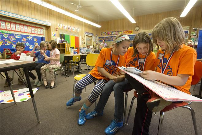 "The Rapid Readers" of Christ King School (left), Antonio Zilvetti, Gwen Tuffnell and Ava Depies, and “The Spicy Onions" of Wilson/STEM School, Claire Ranft, Anya Ranft and Anna LaGrange, tied in the first round of The Battle of the Books competition April 10, at Christ King School.