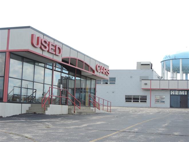 This vacant car dealership is to be the future home of Micro Center, but that development isn’t likely to happen in the near future.