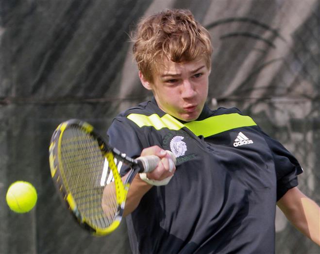 Wauwatosa West’s No. 1 singles player Nick Price returns a serve from Charlie Fahr of Wauwatosa East during the Trojans 4-3 win on May 7.