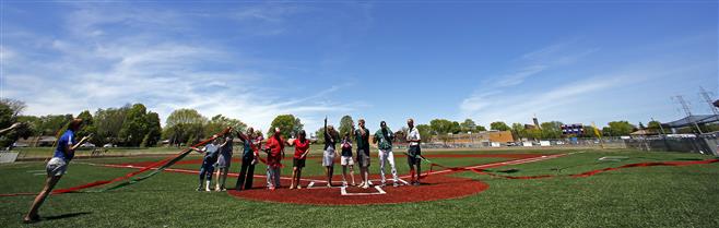 School officials cut colored ribbons to dedicate two new baseball fields at Dale Breitlow Field on Saturday, May 24. Wauwatosa West played Wauwatosa East in the opening game.