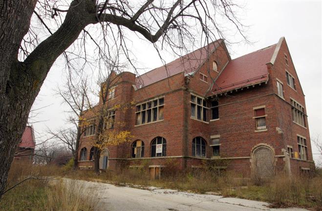 A former administration building designed by Alexander Eschweiler stands solid but in disrepair and vandalized. The University Laboratory School hopes to renovate the building to use for classes.