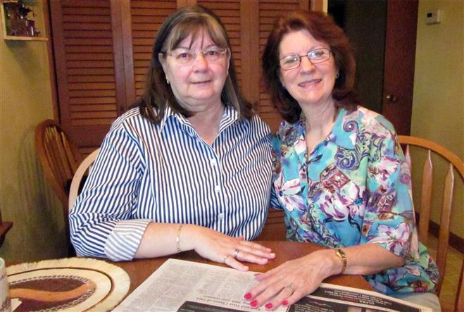 Kathleen Dunn (left) and Lynn Leider are 1964 alumnae of Wauwatosa West. Their class created the school's traditions, like its green and white colors and Trojan mascot.