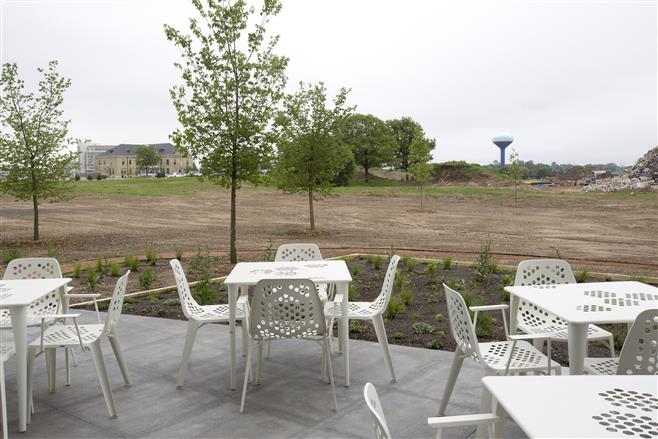 The patio of ABB Corporate Office overlooks the Monarch Trail and Eschweiler Adminstration Building on June 21.