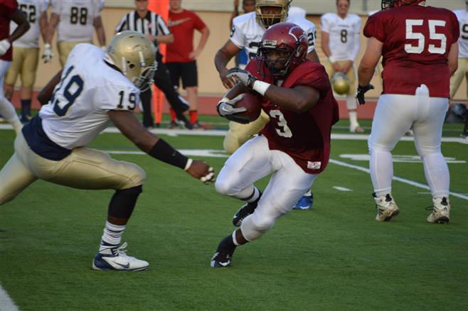 Wauwatosa Spartan running back Bobby Windom cuts back against a Thunder defender to get a first down in a 12-8 win Aug. 16 at Hart Park.