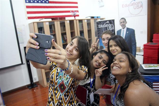 Wauwatosa West Senior Alexis Hardy (bottom right) joins three Tajkistani students and one from Connecticut (left) in taking a selfie at the international iEARN conference in Tajikistan, where students practiced photojournalism.