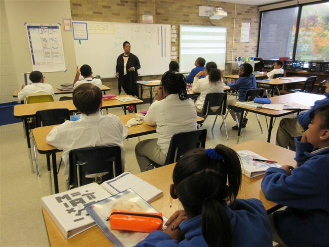 Middle school students sit attentively in a math class at Pilgrim Lutheran School.
