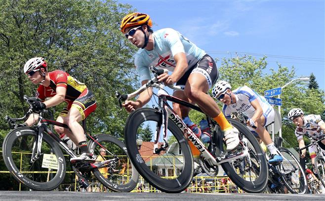 A group of Category 2/3 cyclists eye the start/finish line after turning onto West North Avenue from N.orth 69th Street during the East Tosa Gran Prix on the streets of Wauwatosa last year. The race returns to Tosa Sunday, June 28.