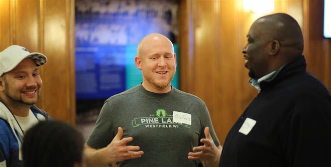 T.J. Brasted, Matt Butters and Terrance Slaughter chat at the Tosa Family Game Night at Hoyt Park inWauwatosa on Dec. 4. The game night was sponsored by City of Light, a new church coming to the Milwaukee /Wauwatosa area in 2016.