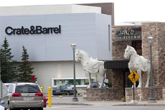 File photo of Crate & Barrel and P.F. Chang's businesses seen in the parking lot of Mayfair Mall in 2013.