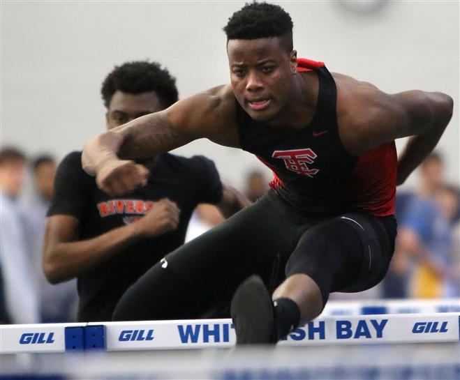 Wauwatosa East’s Tyson Crape competes in the 55-meter hurdles at the Wangerin Invitational track and field meet on March 22 at Whitefish Bay. The Red Raiders finished 23rd out of 28 teams at the Madison West Relays on April 2.