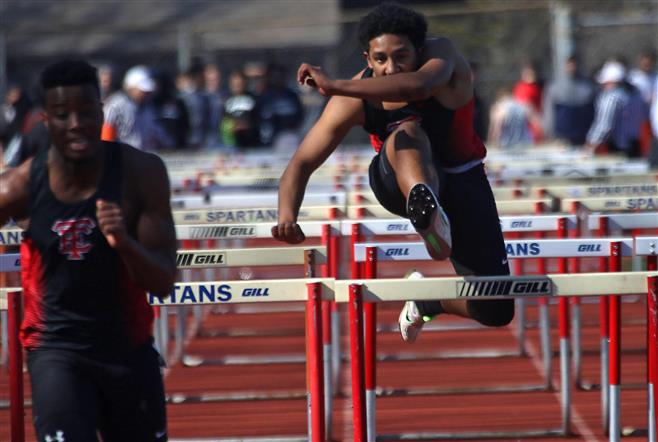 Wauwatosa East’s Taysion Crape (left) and Ali Sabree compete in the 110-meter hurdles at the Mike Gain Spartan Boys Invitational Track and Field Meet on April 12 at Brookfield East. The Red Raiders finished eighth.