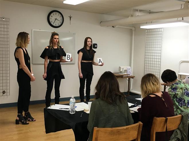 Mount Mary University senior Courtney Raymond (left) presents her fashion design pieces April 25 to a panel of judges during Jury Day, a lead-up event to the school’s CREO fashion show scheduled for May 6. Models Holland Huron (center) and Taylor Raymond show pieces created by Raymond.