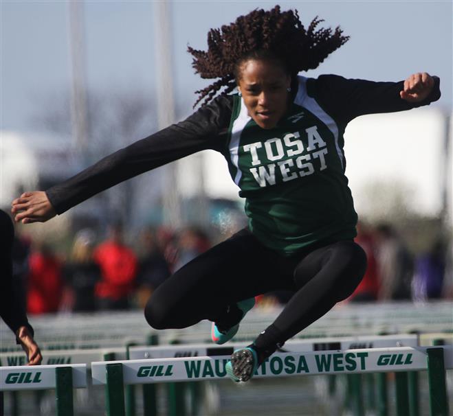 Wauwatosa West’s Kayla Crump took third in the 100 hurdles and the 300 hurdles at the 36th annual Dan Benson Invitational on April 29 at Tosa West. The Trojans finished third at the invite.
