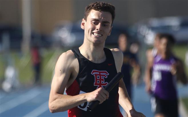 Wauwatosa East anchor runner Sam Potter crosses the finish line during the 4x800 relay event at the West Allis Hale sectional on May 26. East won the event with a time of 7:58.39, the second-fastest time in the school’s history for the event.