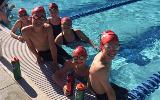 Members of the Tosa Swordfish compete in their swim-a-thon for charity. Among those on hand were (left to right) Anna Miler, Julian Cortright, Samantha Bartelt, Olivia Small, Lily Bartz and Drew Miler.