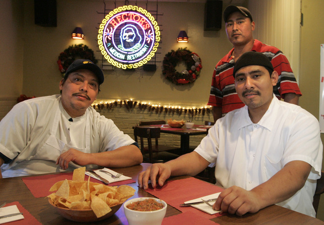Mexican fare at Hector's Mexican Restaurant is prepared by Arcadio Morales (left), Juan Carlos Zetina and Pablo Uelaslo (back).
