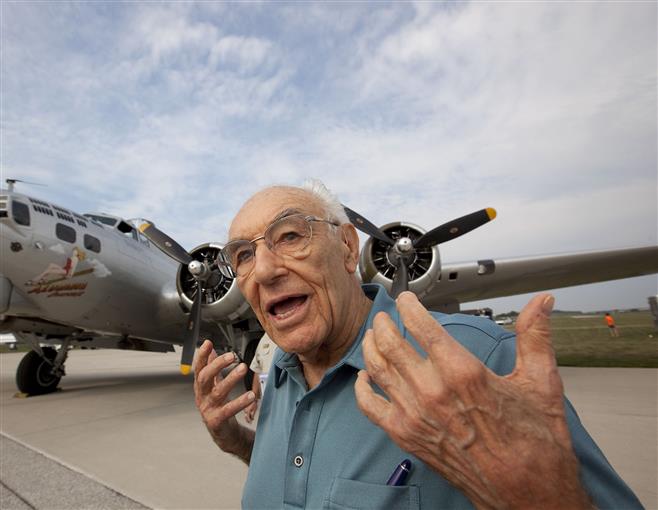Merv Karl, 90, of Park Ridge, Ill., relates his experiences as a B-17 pilot in command during World War II before his flight in B-17 heavy bomber from Crites Field in Waukesha on Friday. Karl flew 35 combat missions at the age of 22.