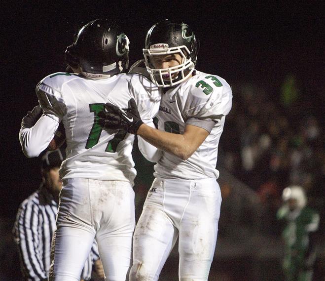 Greendale's Jake Zywicki (33) celebrates with Cody Kmetz after Kmetz scored Greendale's third touchdown.