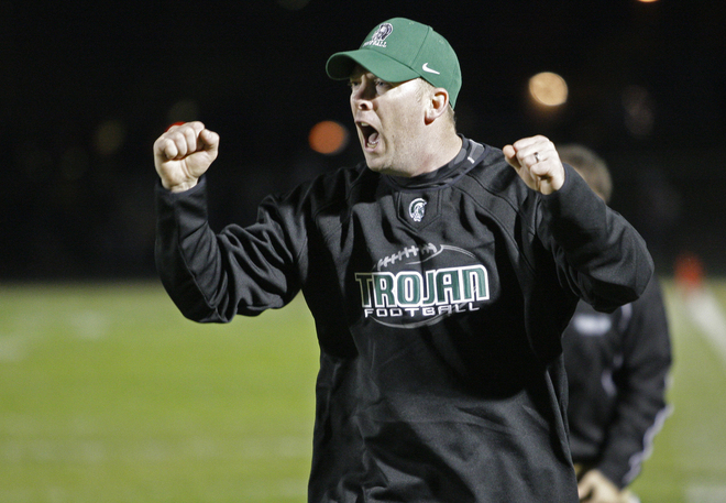 Wauwatosa West head coach Matt Good cheers on his team.