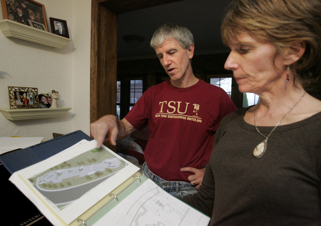 Mike and Judy Doyle review site plans for a Hart Park skatepark in this 2009 photo. At that time the idea was in its infancy.