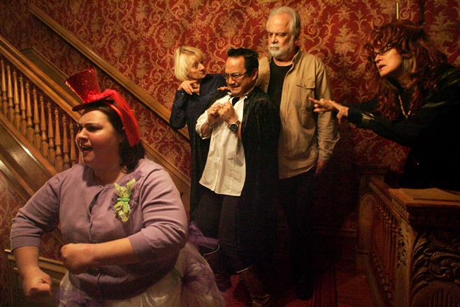 The Kneeland Walker House stairwell is the stage for Brooke Wegner (left), Nancy Domres, Clarence Aumend, Ken Smith, Marcia Mirr (right) and other characters in the 10th anniversary performance by the Hysterical Society Players in “The Night the Circus Died.”