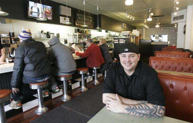 Milke Topolovich is the owner of the New North Avenue Grill that reopened on Feb. 4 with counter stools and booths along the walls. A restaurant has occupined the storefront at 7225 W. North Ave. since the 1930s.