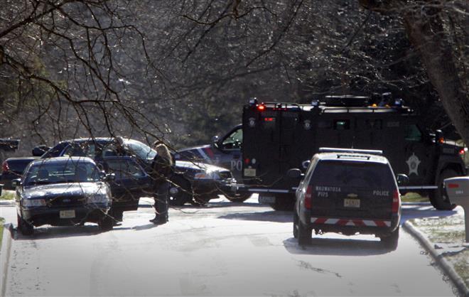 Law enforcement and emergency response vehicles converge at 120th and Cherry streets in Wauwatosa on Monday.