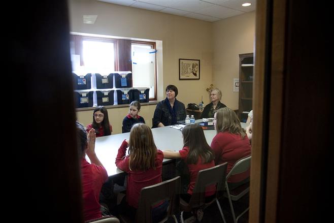 Wauwatosa Catholic School students are interviewed by representatives of the International Baccalaureate behind closed doors in the school March 25.