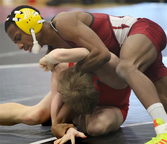 Wauwatosa’s Justin Folley (top) wrestles Sussex Hamilton’s Dustin Greipentrog in the first-round 126-pound match during WIAA sectional competition at Menomonee Falls on Feb. 21. Folley won by a technical fall. Wauwatosa’s Justin Folley (top) wrestles Sussex Hamilton’s Dustin Greipentrog in the first-round 126-pound match during WIAA sectional competition at Menomonee Falls on Feb. 21. Folley won by a technical fall.