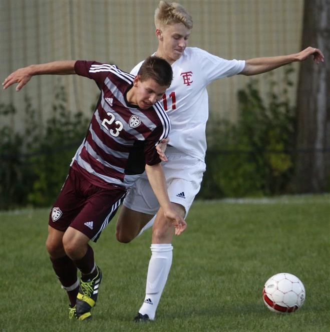 Menomonee Falls’ Collin Dowling (23) and Wauwatosa East’s John Ensch (11) battle for control of the ball during the first half of the Indians’ 4-3 win on Aug. 27 at Whitman Field.